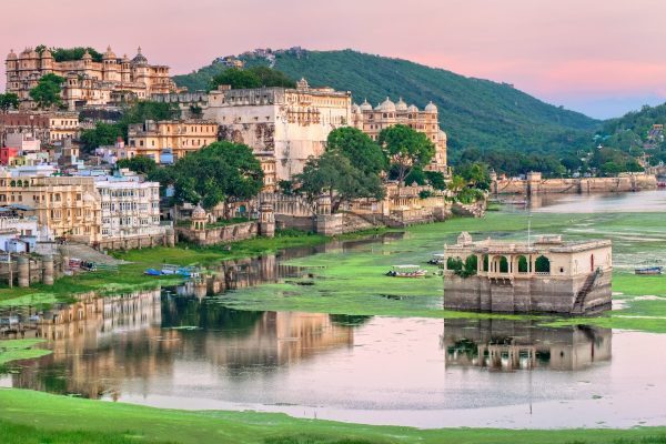 View of Udaipur, India, on sunset Maharajah palace and lake Pichola in the old town of Udaipur, India, on sunset