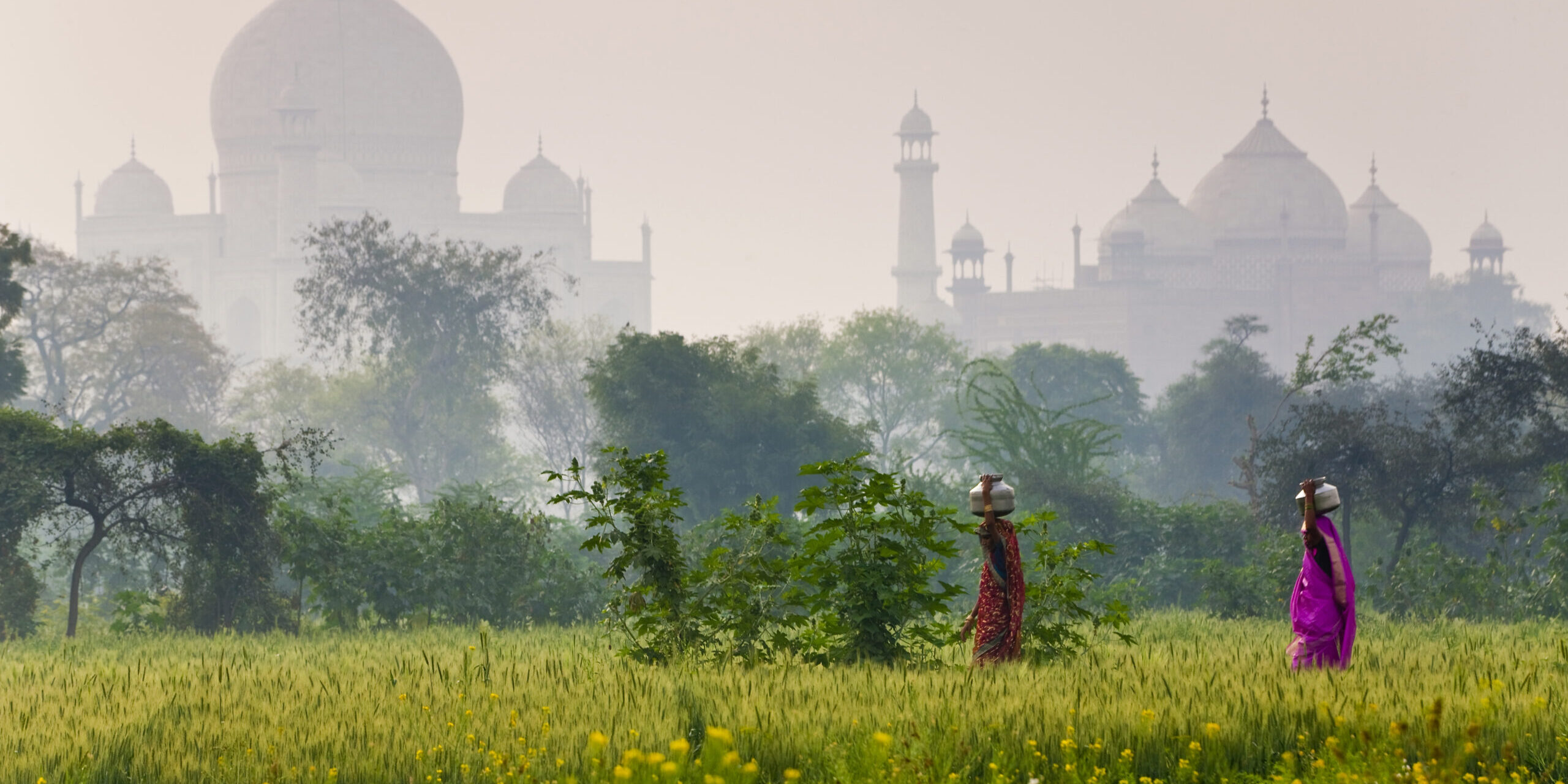 Taj Mahal,India,Taj Mahal in Agra, Two woman carrying loads on their heads.